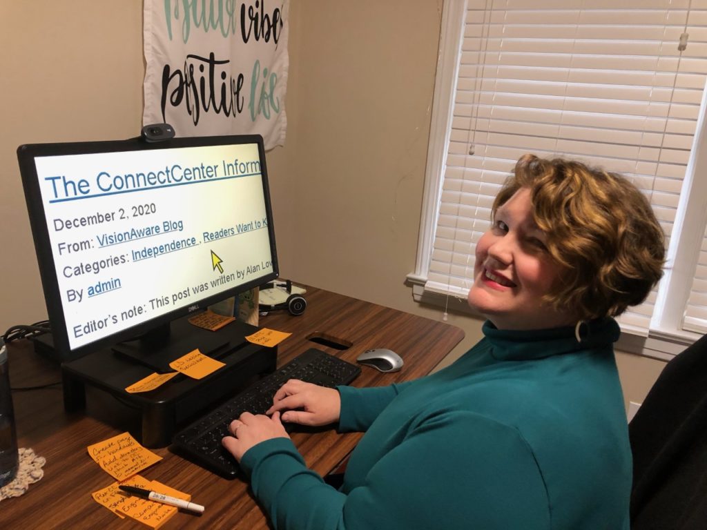 Woman at computer with magnified text