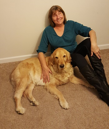 Sheila sitting on floor with dog