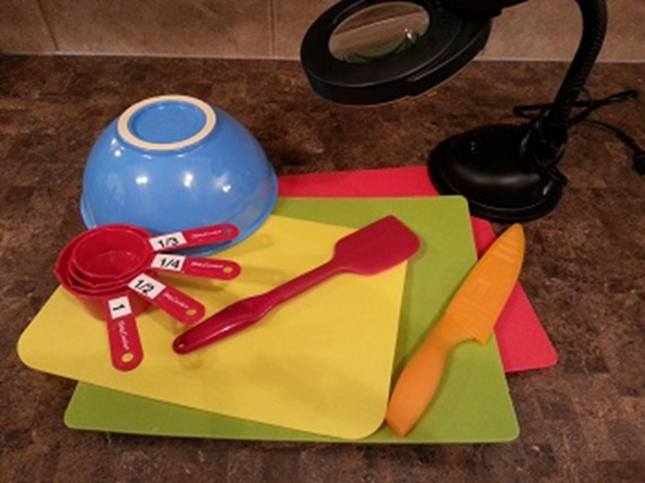 Multicolored kitchen utensils with large print numbered measuring cups